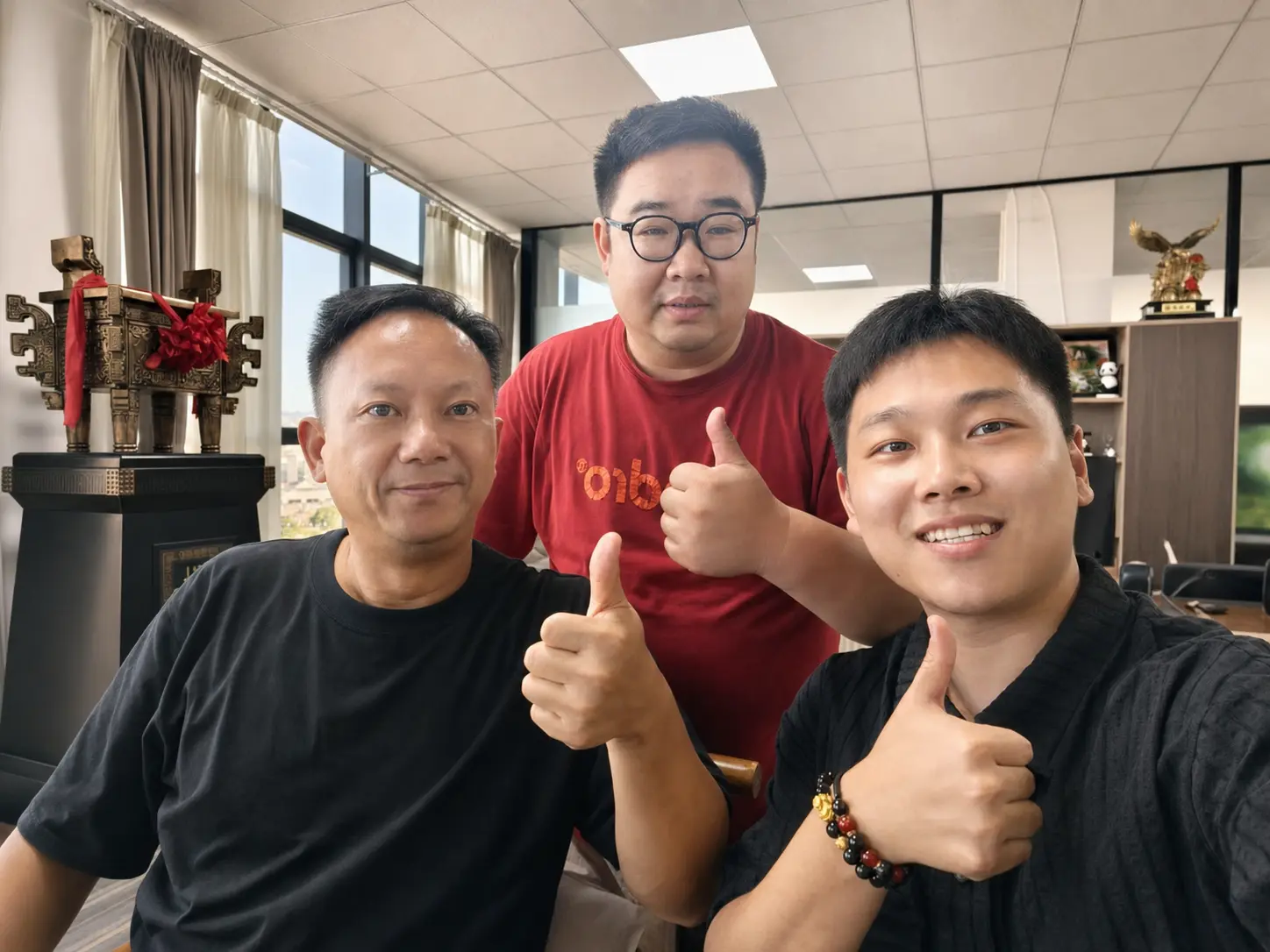 Three MuphoenixEco team members together in the office